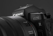 Canon EOS R Review Image of Canon EOS R Mirrorless Digital Camera with Canon EF 24-105mm f4L IS USM lens on a black background. Canon is the world largest SLR camera manufacturer.