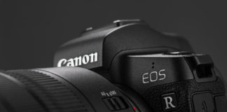 Canon EOS R Review Image of Canon EOS R Mirrorless Digital Camera with Canon EF 24-105mm f4L IS USM lens on a black background. Canon is the world largest SLR camera manufacturer.