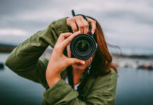 Best DSLR Cameras Under $1,000 in 2025: Expert Buying Guide A young woman using a DSLR camera