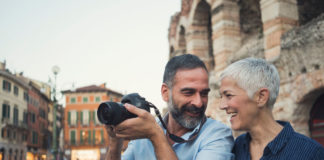 Best Digital Cameras for Seniors: Practical Buying Guide Mature couple as tourist using a camera in city Verona
