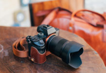 Best Mirrorless Cameras Under $1000 in 2025: Expert Value Analysis Digital mirrorless camera on a desk with a large lens