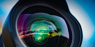 Best lens for sony a6500 Cameras A seascape sunset reflected in the large front element of a 15mm wide angle lens, with the coloured lens element coatings enhancing the effect.