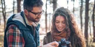Best Camera for Beginners in 2023 Photo of young couple with beginners camera in nature
