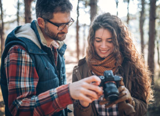 Best Camera for Beginners in 2023 Photo of young couple with beginners camera in nature
