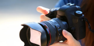 Cheapest Full-Frame Cameras in 2025: Budget Full-Frame Buying Guide A Young Woman Holding a Full Frame Camera.