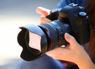 Cheapest Full-Frame Cameras in 2025: Budget Full-Frame Buying Guide A Young Woman Holding a Full Frame Camera.