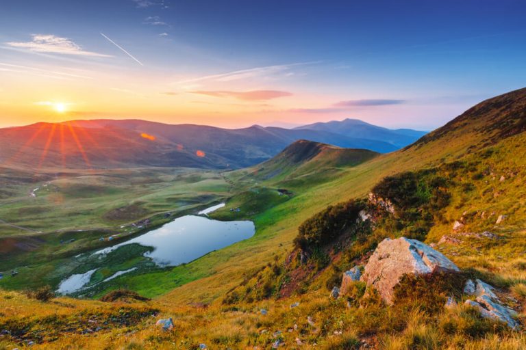 Landscape photography guide cover image showing a dramatic sunset landscape