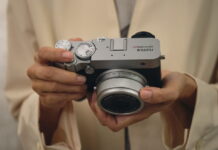 Fujifilm GFX100RF Review: 102MP With Real Tradeoffs Photographer holding the Fujifilm GFX100RF medium format camera